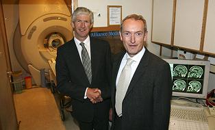 Photograph of Health Minister John Hutton MP shaking hands with Alliance Medical boss Jonathan Walsh